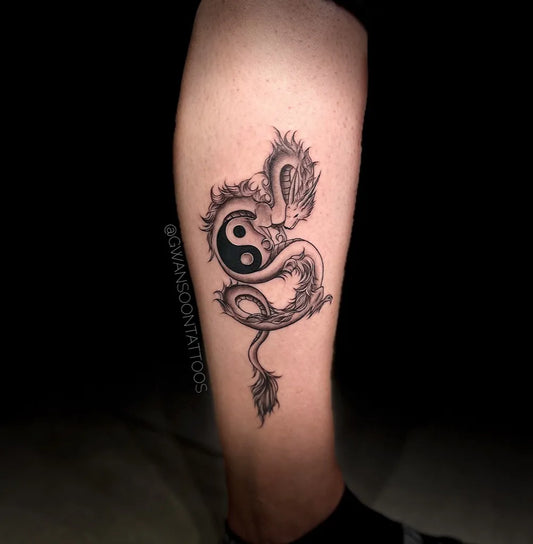 Medium Blackwork Yin Yang Dragon Tattoo on Men Leg by @gwansoontattoos