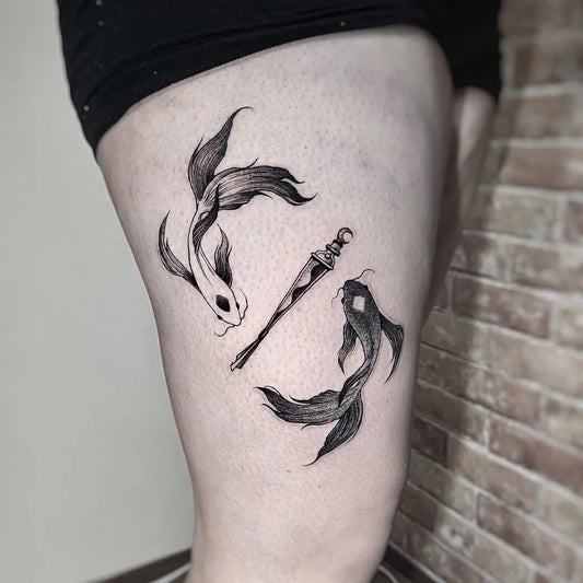 Medium Blackwork Yin Yang Koi and Dagger Tattoo on Women Thigh by @zigm.or.never