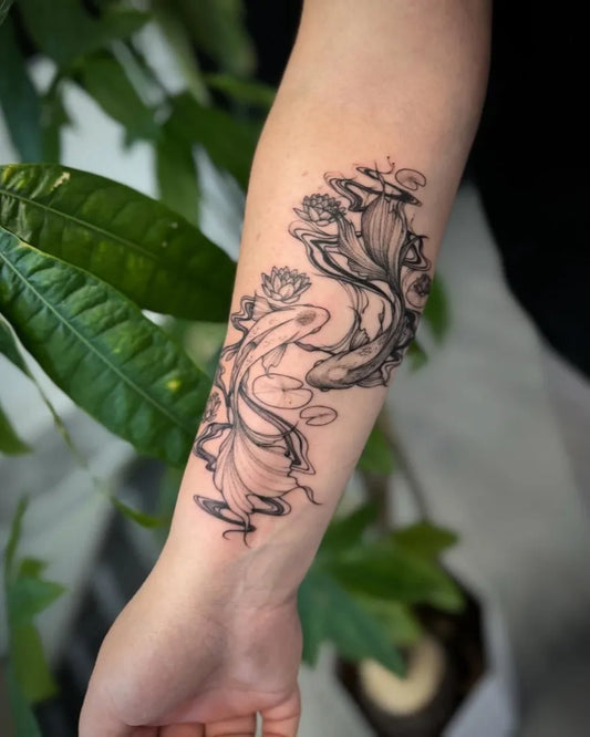 Medium Blackwork Yin Yang Koi and Lotus Tattoo on Women Arm by @natts_tatts