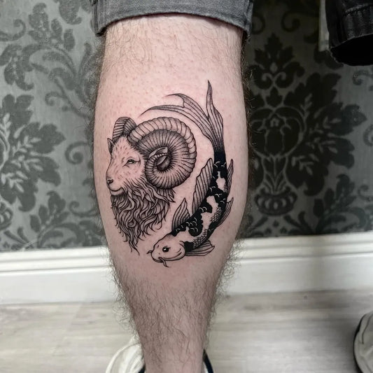 Medium Blackwork Yin Yang Ram Koi Tattoo on Men Leg by @raymoonshine_tattoos