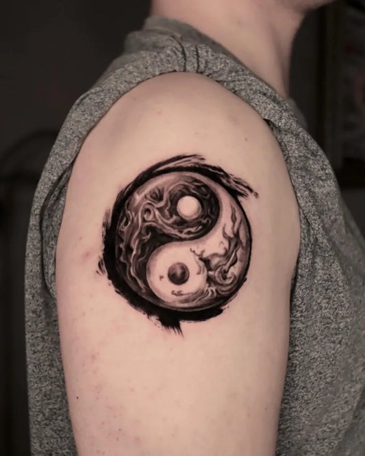 Medium Blackwork Yin Yang Tattoo on Men Shoulder by @checky_tattoo