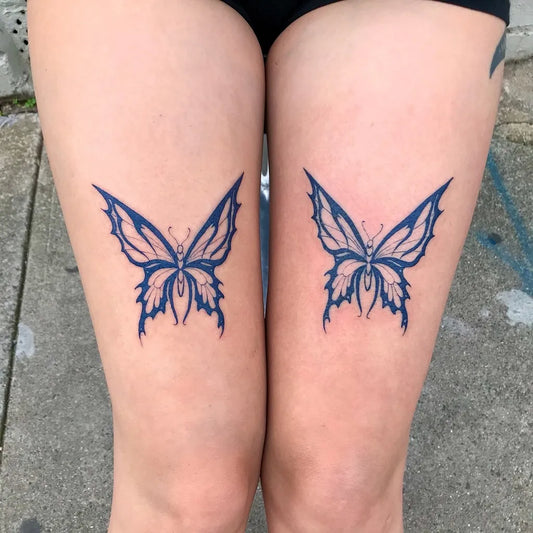 Medium Blue Butterfly Tattoo on Women Thigh by @miss_preciouss