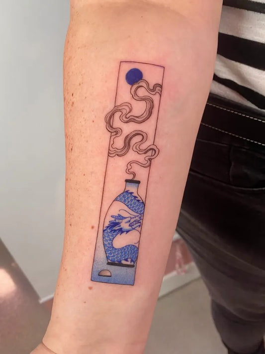 Medium Blue Chinese Vase with Dragon and Smoke Tattoo on Women Arm by @xinyu.art