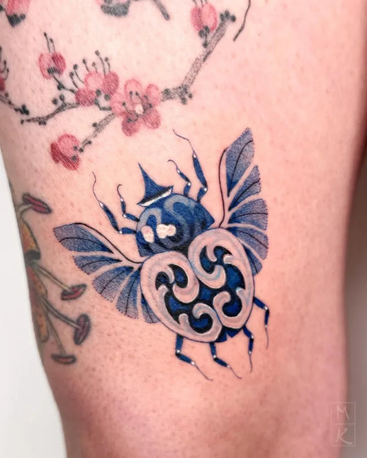 Medium Blue Japanese Beetle Tattoo on Women Arm by @mayuka_tattoo