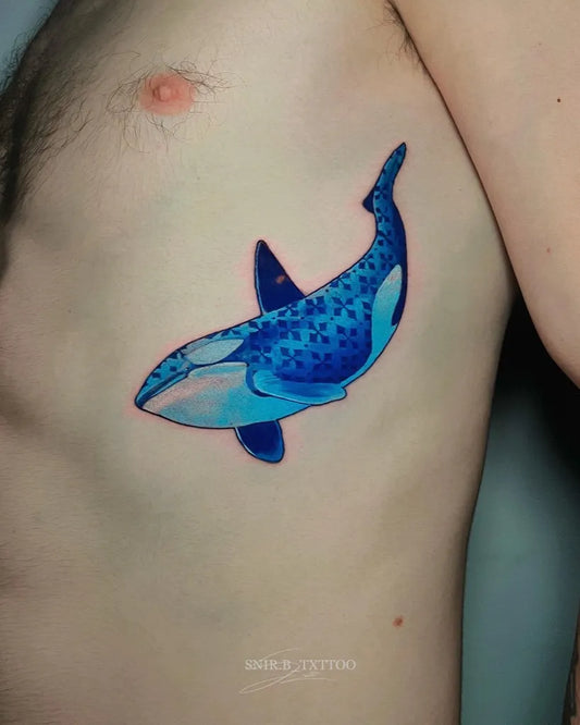 Medium Blue Orca Tattoo on Men Ribcage by @snir.b_txttoo