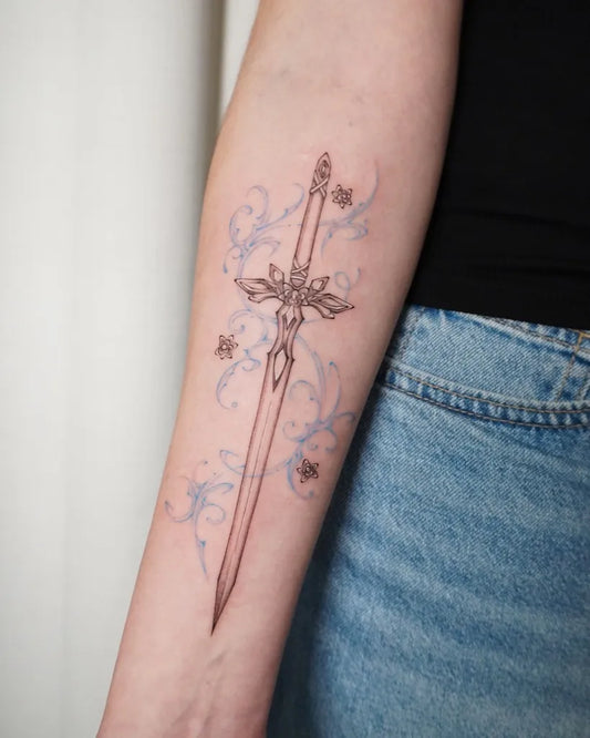 Medium Blue Rose Sword with Floral Ornamentation on Women Arm Tattoo by @tattooist_kelly