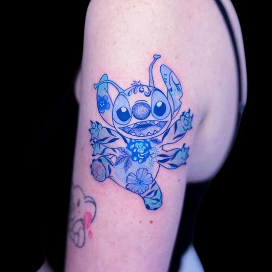 Medium Blue Stitch with Flowers Tattoo on Women Shoulder by @june.tattoo75