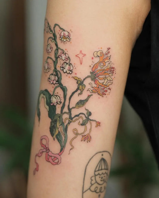 Medium Botanical Lily of the Valley and Flowers on Women Arm Tattoo by @momo.tattooist