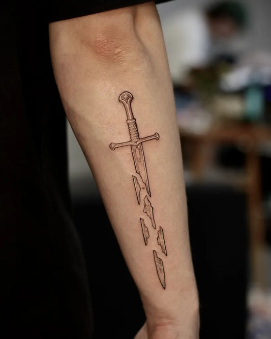 Medium Broken Sword with Shards on Men Arm Tattoo by @badlystuffedanimal