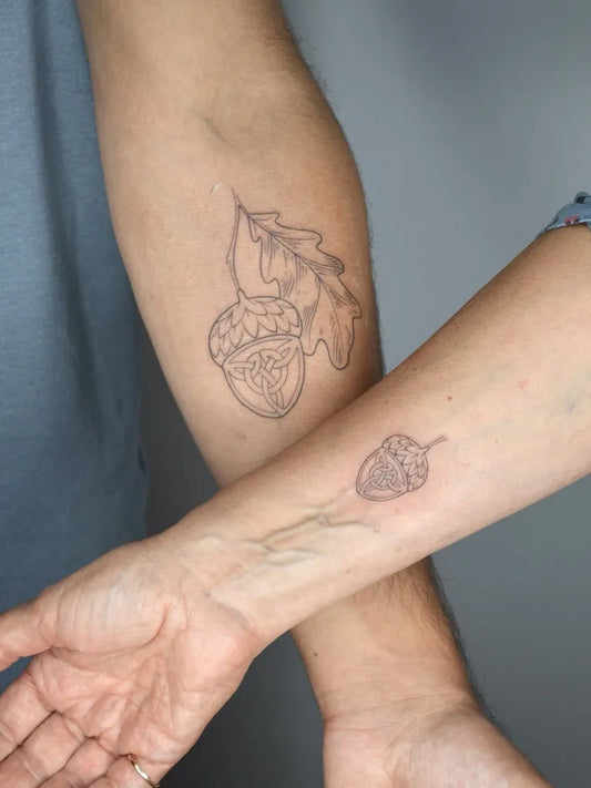 Medium Celtic Acorn and Oak Leaf Tattoo on Women Arm by @rachelgros_tattoos