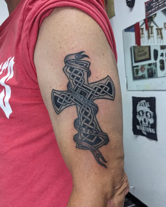 Medium Celtic Cross Snakes on Women Arm Tattoo by @inkillusionstattoo
