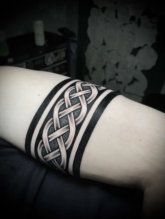 Medium Celtic Knot Band Tattoo on Men Arm by @twrch_knot