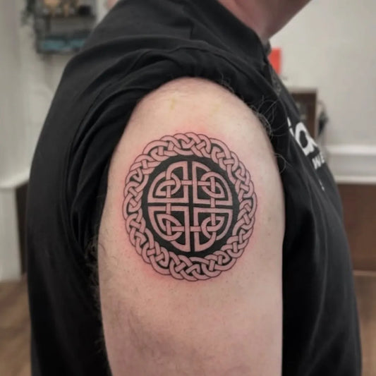 Medium Celtic Knot Circle Tattoo on Men Upper Arm by @lifestooshort.tattoo