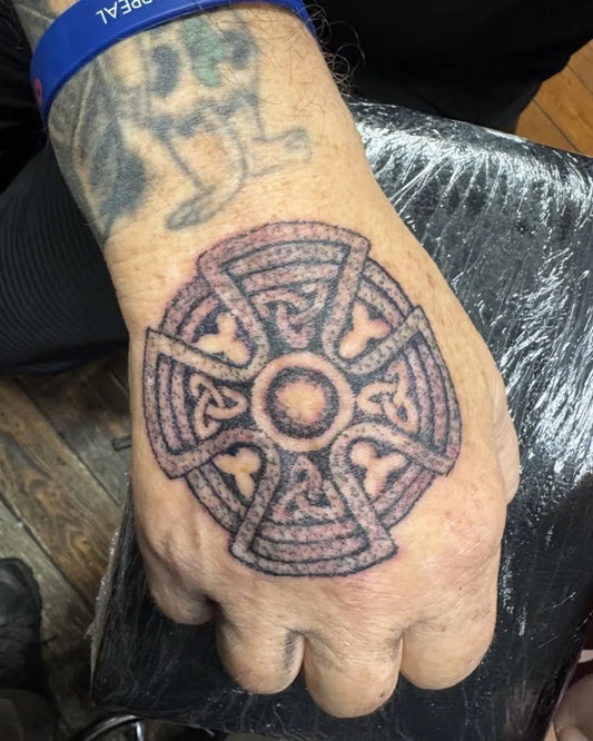Medium Celtic Knot Cross Tattoo on Men Hand by @psychodelink_tattoo
