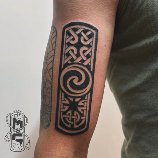Medium Celtic KnotworkPanelwithTriskelion Tattoo on Men Arm by @mariegloesenertattoos