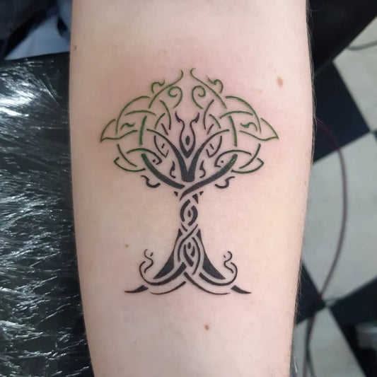 Medium Celtic Tree Tattoo on Women Arm by @nxwxpxr