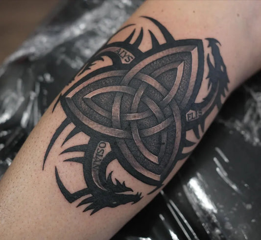 Medium Celtic Triquetra Shield Dragons Tattoo on Men Arm by @ryanaudreytattoo