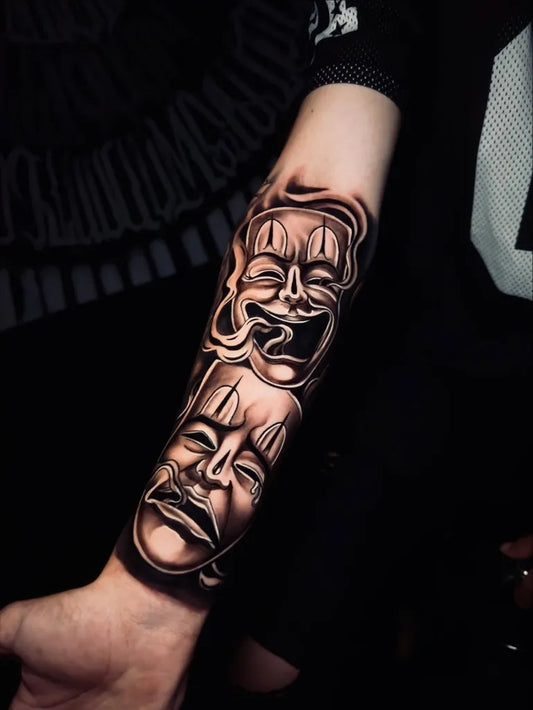 Medium Chicano Dual Theater Masks Tattoo on Women Arm by @amoreink_jf.tattoo