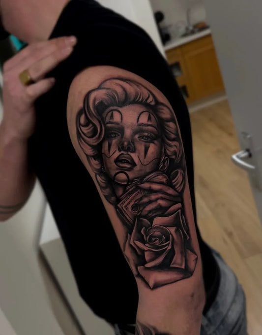 Medium Chicano Marilyn Monroe with Sugar Skull and Rose Tattoo on Men Arm by @inkedbyruthl3ss