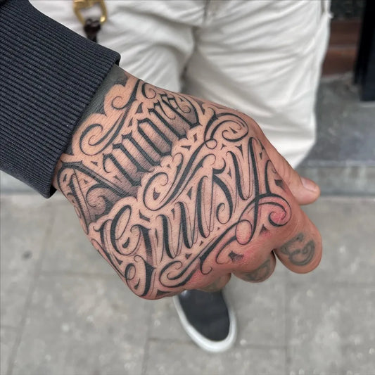 Medium Chicano Name Tattoo on Men Hand by @alexxbrandy