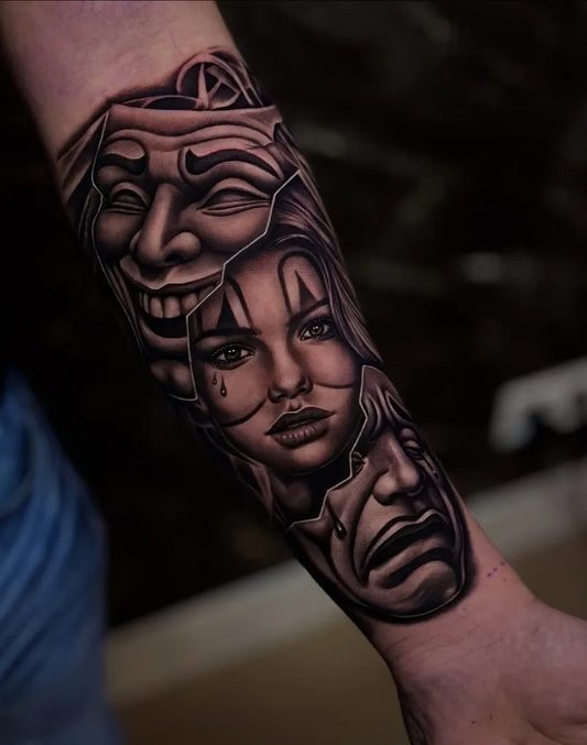 Medium Chicano Smiling and Frowning Theater Masks Tattoo on Men Arm by @imperialtattoonl