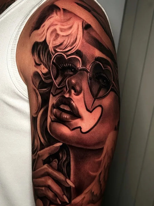 Medium Chicano Woman with Heart Glasses Tattoo on Women Arm by @antoniodypalo_tattoos