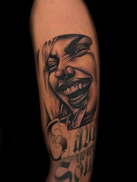 Medium Chicano laughing woman with text Tattoo on Women Arm by @rusttytattoo