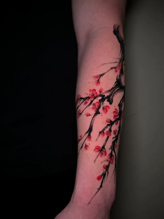 Medium Chinese Cherry Blossom Branch Tattoo on Women Arm by @tyang.ink