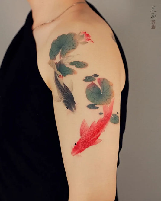 Medium Chinese Koi Fish and Lily Pads Tattoo on Men Shoulder by @tattoo.vinc