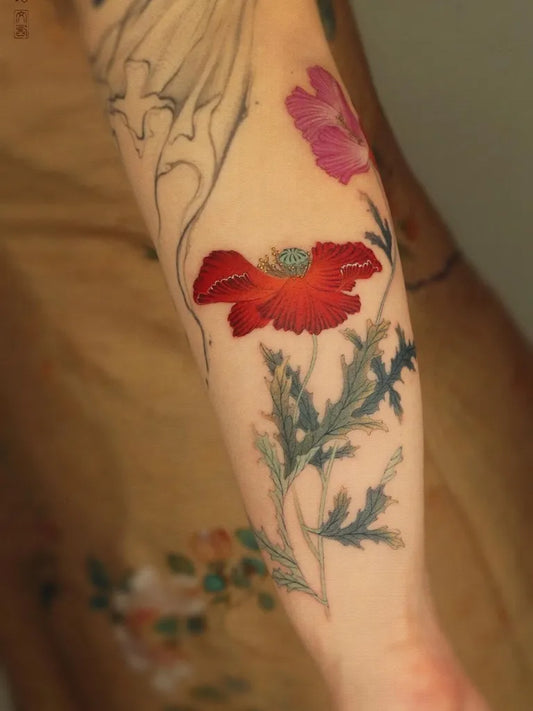 Medium Chinese Poppy Flowers and Leaves Tattoo on Women Arm by @fuguang.tattoo.studio