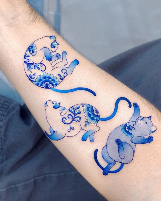 Medium Chinoiserie Cats and Flowers Tattoo on Women Arm by @vismstudio