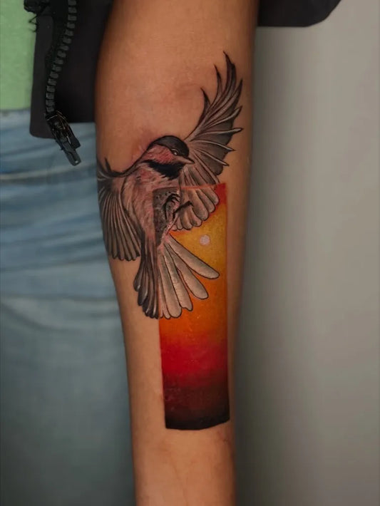 Medium Color Chestnut Chickadee Bird Tattoo on Women Arm by @blackpearlink