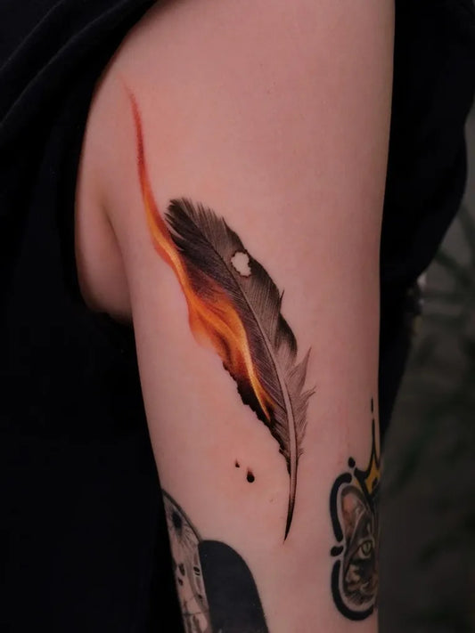 Medium Color Realism Feather Tattoo on Women Upper Arm by @newtattoo_zu