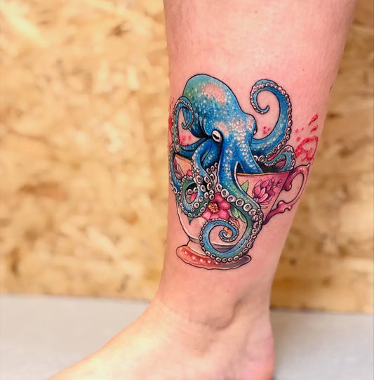 Medium Color Realism Octopus Teacup Tattoo on Women Leg by @kayleyjaynetattoos