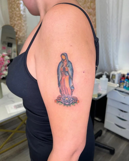 Medium Color Realism Virgin Mary with Lotus Tattoo on Women Arm by @rezichitattoos