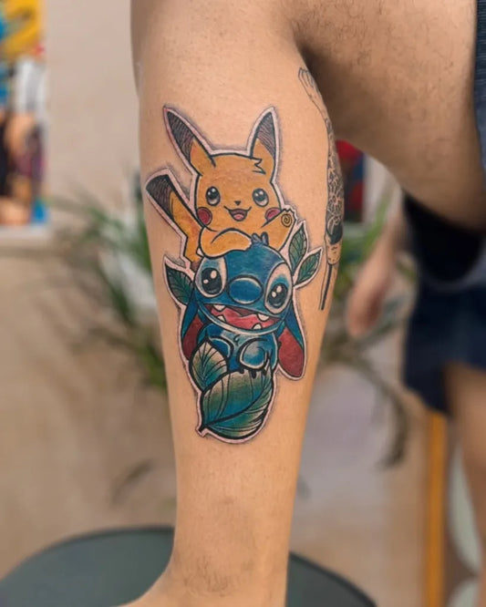 Medium Color Work Pikachu Stitch Tattoo on Men Leg by @vi_tattoo_studio_delhi