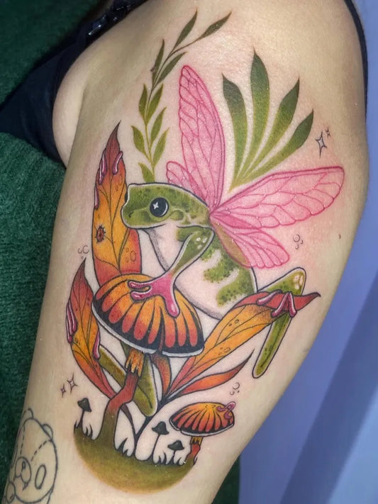 Medium Colorful Fairy Frog Mushroom Tattoo on Women Arm by @sou.maru.tattoo