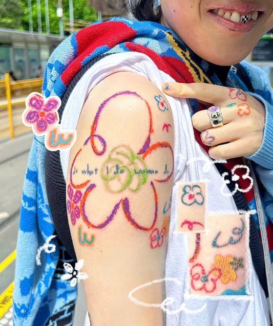 Medium Colorful Flowers and Text Tattoo on Women Arm by @hakunamatatattoo_