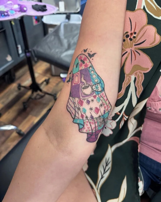 Medium Colorful Patchwork Scarecrow Tattoo on Women Arm by @inkandoathtattoo