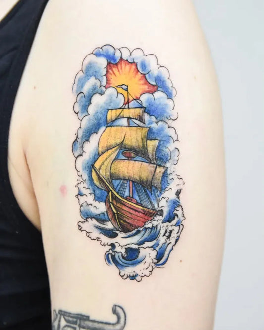Medium Colorful Sailing Ship with Sun and Waves Tattoo on Men Arm by @_nono_tattoo