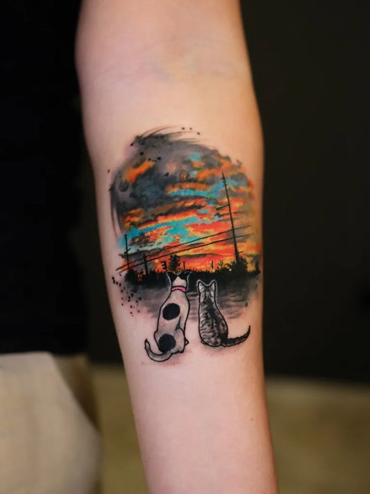 Medium Colorful Sunset with Dog and Cat Tattoo on Women Arm by @edith__art