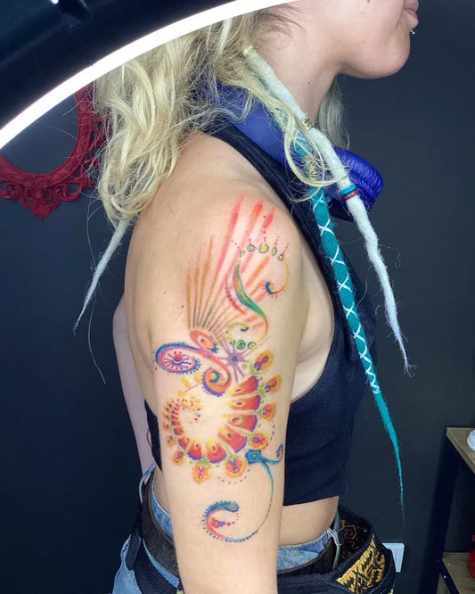 Medium Colorful Swirling Phoenix Tattoo on Women Shoulder by @cartoontatu