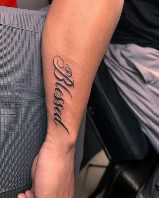 Medium Cursive Blessed Word on Men Arm Tattoo by @darcastudio