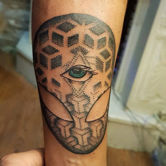 Medium Dotwork Alien Head Tattoo on Men Arm by @parsa.taebi