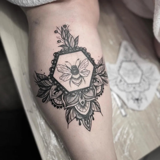 Medium Dotwork Bee Mandala on Women Thigh Tattoo by @heartofthievestattoo