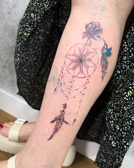 Medium Dotwork Dream Catcher with Hummingbird and Feathers Tattoo on Women Leg by @paulo_borrega