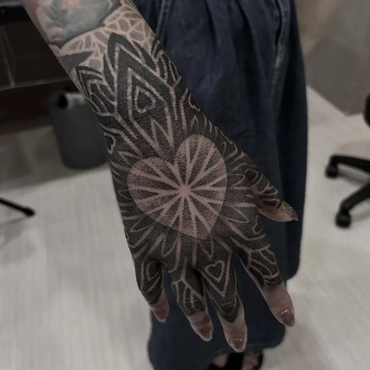 Medium Dotwork Mandala Heart Tattoo on Women Hand by @cowbala_tattoo
