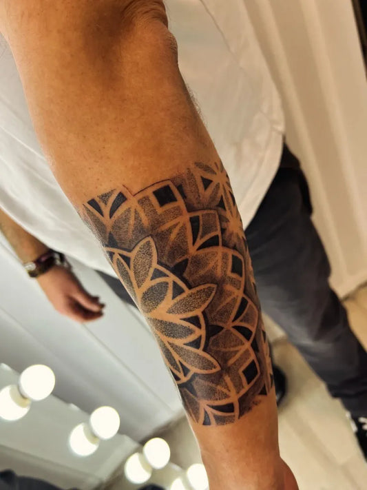 Medium Dotwork Mandala Tattoo on Men Arm by @fineliner_tattoo