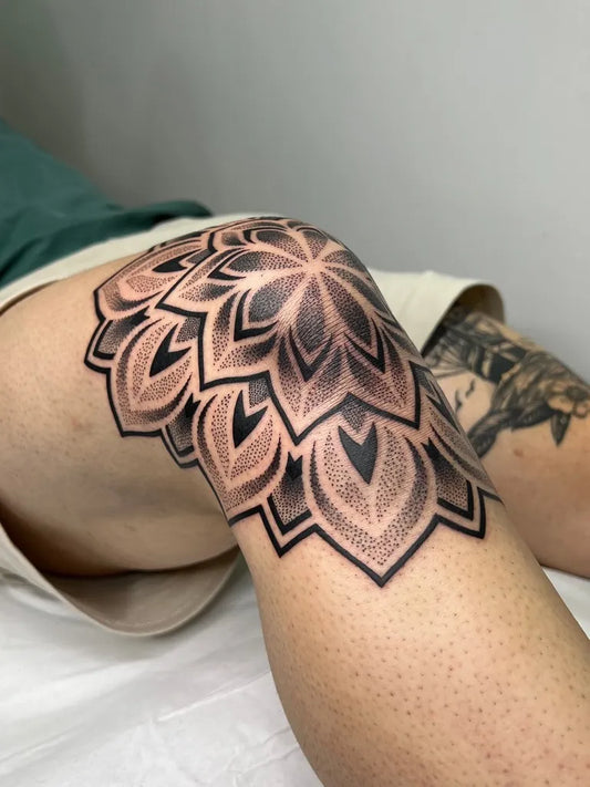 Medium Dotwork Mandala Tattoo on Men Knee by @caiocerejatattoo