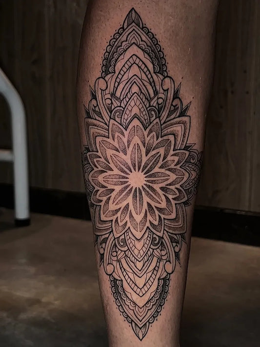 Medium Dotwork Mandala Tattoo on Men Leg by @dani_aguiarte